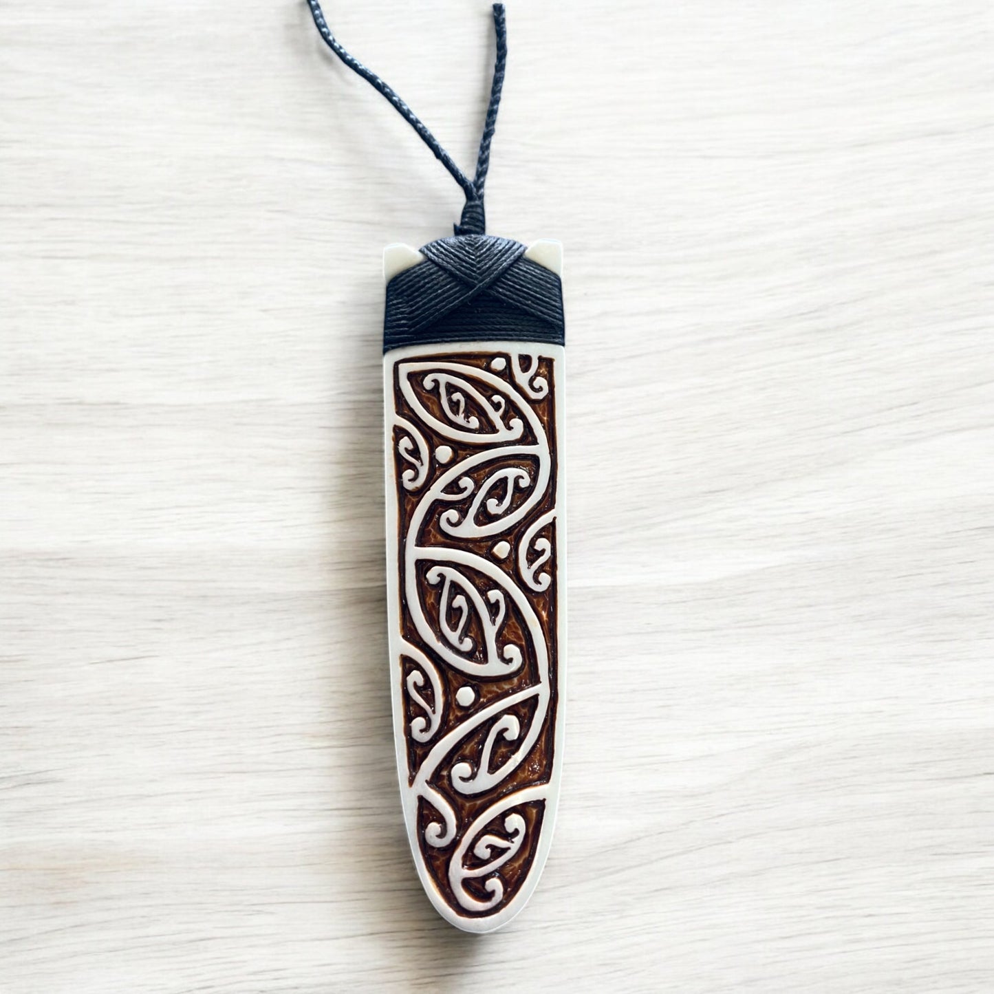 NZ Bone Toki Pendant (Kowhaiwhai Design Stained)